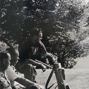 A wall covering of two men sitting under a tree